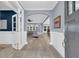 Elegant foyer with wood floors, white wainscoting, and an open view into the living room at 455 Hidden Meadow Ln, Summerville, SC 29486