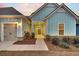 Charming entryway with light blue siding and neatly landscaped bushes leading to the front door at 455 Hidden Meadow Ln, Summerville, SC 29486
