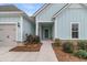 Charming, single-story home featuring light blue siding, brick accents, and a well-maintained front yard at 455 Hidden Meadow Ln, Summerville, SC 29486