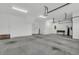 Spacious and clean three car garage with white walls at 455 Hidden Meadow Ln, Summerville, SC 29486
