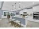 Modern kitchen boasts a large center island, pendant lighting, and stainless steel appliances at 455 Hidden Meadow Ln, Summerville, SC 29486