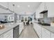 Beautiful kitchen featuring white cabinets, an island, stainless steel appliances, and an open layout at 455 Hidden Meadow Ln, Summerville, SC 29486