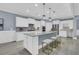 Modern kitchen with white cabinets, stainless steel appliances, and a central island with seating at 455 Hidden Meadow Ln, Summerville, SC 29486