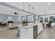 Bright, open-concept kitchen with an island and stainless steel appliances overlooking the living space at 455 Hidden Meadow Ln, Summerville, SC 29486