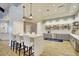 Inviting kitchenette area with a central island, stylish seating, and well-organized shelving for storage at 455 Hidden Meadow Ln, Summerville, SC 29486