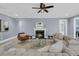 Cozy living room showcasing a fireplace, comfortable seating, and light blue walls at 455 Hidden Meadow Ln, Summerville, SC 29486