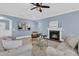 Elegant living room with a fireplace, neutral walls, and stylish decor at 455 Hidden Meadow Ln, Summerville, SC 29486