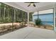 This screened porch features a ceiling fan and views of the lush outdoor scenery at 455 Hidden Meadow Ln, Summerville, SC 29486