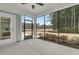 Screened porch providing serene views of the backyard and surrounding nature at 455 Hidden Meadow Ln, Summerville, SC 29486
