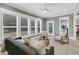 Comfortable sunroom filled with natural light through shuttered windows, perfect for relaxing at 455 Hidden Meadow Ln, Summerville, SC 29486