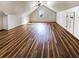 Bright attic space features hardwood floors, a ceiling fan, and a small window for natural light at 503 Middleton Blvd, Summerville, SC 29485