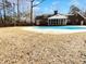 Spacious backyard with a large pool and a screened-in porch, perfect for outdoor entertainment at 503 Middleton Blvd, Summerville, SC 29485
