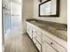 Bright bathroom with a granite-topped double sink vanity and a glass-enclosed shower at 503 Middleton Blvd, Summerville, SC 29485