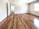 An airy bedroom with wood-look flooring and an open doorway to the landing at 503 Middleton Blvd, Summerville, SC 29485
