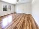 Bright bedroom featuring wood-look floors, a ceiling fan, and a window offering natural light at 503 Middleton Blvd, Summerville, SC 29485