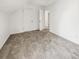 Upstairs bedroom featuring neutral carpet and closet with a view into the hall at 503 Middleton Blvd, Summerville, SC 29485