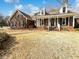 Charming brick home featuring a covered front porch, dormer windows and well maintained lawn at 503 Middleton Blvd, Summerville, SC 29485