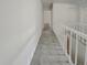 Upstairs hallway with white railing and access to multiple rooms at 503 Middleton Blvd, Summerville, SC 29485