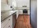 Updated kitchen with granite countertops, stainless steel appliances, and white cabinetry at 503 Middleton Blvd, Summerville, SC 29485