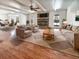 Inviting living room with hardwood floors, a brick fireplace, and plenty of natural light at 503 Middleton Blvd, Summerville, SC 29485