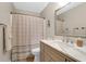 Neutral bathroom features a vanity with a sink, mirror, lighting, toilet, and shower with curtain at 536 Castle Hall Rd, Mount Pleasant, SC 29464