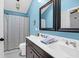 Bright bathroom features a double sink vanity, a shower with a curtain, and a toilet at 536 Castle Hall Rd, Mount Pleasant, SC 29464