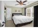 Cozy bedroom features a ceiling fan, a queen-size bed, and a large window at 536 Castle Hall Rd, Mount Pleasant, SC 29464
