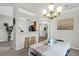 Bright dining area with chandelier, table with seating for four, and view of the kitchen at 536 Castle Hall Rd, Mount Pleasant, SC 29464