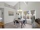 Charming dining area features a decorative chandelier and views to the fenced backyard at 536 Castle Hall Rd, Mount Pleasant, SC 29464
