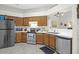 Functional kitchen with stainless steel appliances, wood cabinets, and a tile floor at 536 Castle Hall Rd, Mount Pleasant, SC 29464