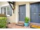 Charming brick home featuring a blue door, gray shutters, and a quaint window at 554 Savannah Hwy # 6, Charleston, SC 29407