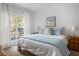 Cozy bedroom with a large window, comfortable bed, and views of the outdoor scenery at 700 Daniel Ellis Dr # 8108, Charleston, SC 29412