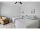 Guest bedroom with tile floor, two twin beds, and coastal artwork at 700 Daniel Ellis Dr # 8108, Charleston, SC 29412