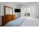 Comfortable bedroom with natural light, large dresser, and a view of the outdoor greenery at 700 Daniel Ellis Dr # 8108, Charleston, SC 29412
