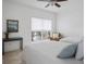 Bright bedroom featuring two beds, a window, and a calm, neutral color palette for a serene retreat at 700 Daniel Ellis Dr # 8108, Charleston, SC 29412