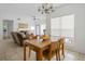 Inviting dining area featuring a wooden table, chandelier, and plenty of natural light at 700 Daniel Ellis Dr # 8108, Charleston, SC 29412