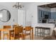 Open dining area with wooden table and chairs adjacent to a modern kitchen at 700 Daniel Ellis Dr # 8108, Charleston, SC 29412