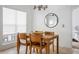 Cozy dining area with wooden table and chairs, offering a view to the bedroom at 700 Daniel Ellis Dr # 8108, Charleston, SC 29412