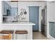 Stylish kitchen showcasing a quartz countertop island with barstool seating and blue cabinetry at 700 Daniel Ellis Dr # 8108, Charleston, SC 29412