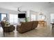 Open-concept living area with stone fireplace, comfortable seating, and dining space at 700 Daniel Ellis Dr # 8108, Charleston, SC 29412