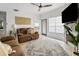 Cozy living room featuring plush sofas, stone fireplace, and natural light at 700 Daniel Ellis Dr # 8108, Charleston, SC 29412