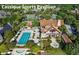 Aerial view features a sports pavilion with a pool, tennis courts, and beautifully landscaped grounds at 707 Glossy Ibis Ln, Kiawah Island, SC 29455