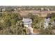 Aerial view of a beautiful two-story home surrounded by mature trees and landscaping at 707 Glossy Ibis Ln, Kiawah Island, SC 29455