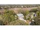 An aerial view showcases a home with a charming exterior amidst lush greenery and mature trees at 707 Glossy Ibis Ln, Kiawah Island, SC 29455