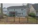 Fenced backyard featuring a patio, covered area, and lush greenery at 7217 Mossy Creek Ln, Hanahan, SC 29410