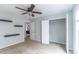 A bedroom with floating shelves, carpet floors, closet, and light blue walls at 7217 Mossy Creek Ln, Hanahan, SC 29410