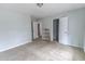 This bedroom features neutral carpet, freshly painted walls, and two closet doors at 7217 Mossy Creek Ln, Hanahan, SC 29410