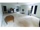 A large carpeted bonus room with several windows and a wood table at 7217 Mossy Creek Ln, Hanahan, SC 29410