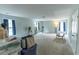 A large carpeted bonus room with several windows and furniture at 7217 Mossy Creek Ln, Hanahan, SC 29410