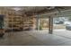 Spacious garage with built-in shelving, providing ample storage space for tools and equipment at 7217 Mossy Creek Ln, Hanahan, SC 29410